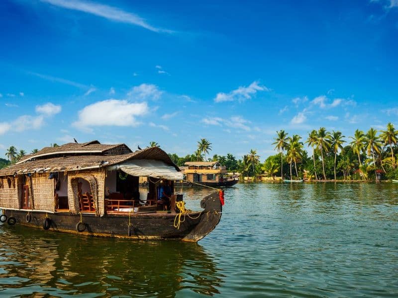 Group of students on a backwater houseboat in Kerala