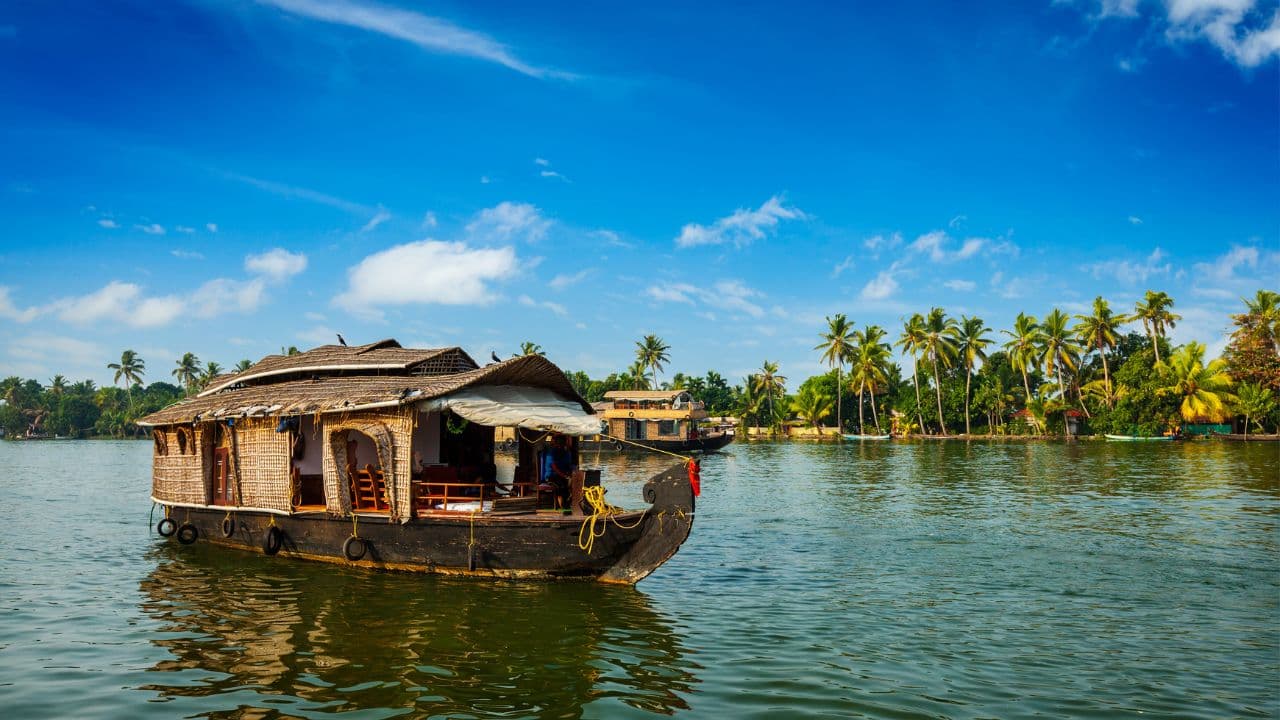 Group of students on a backwater houseboat in Kerala
